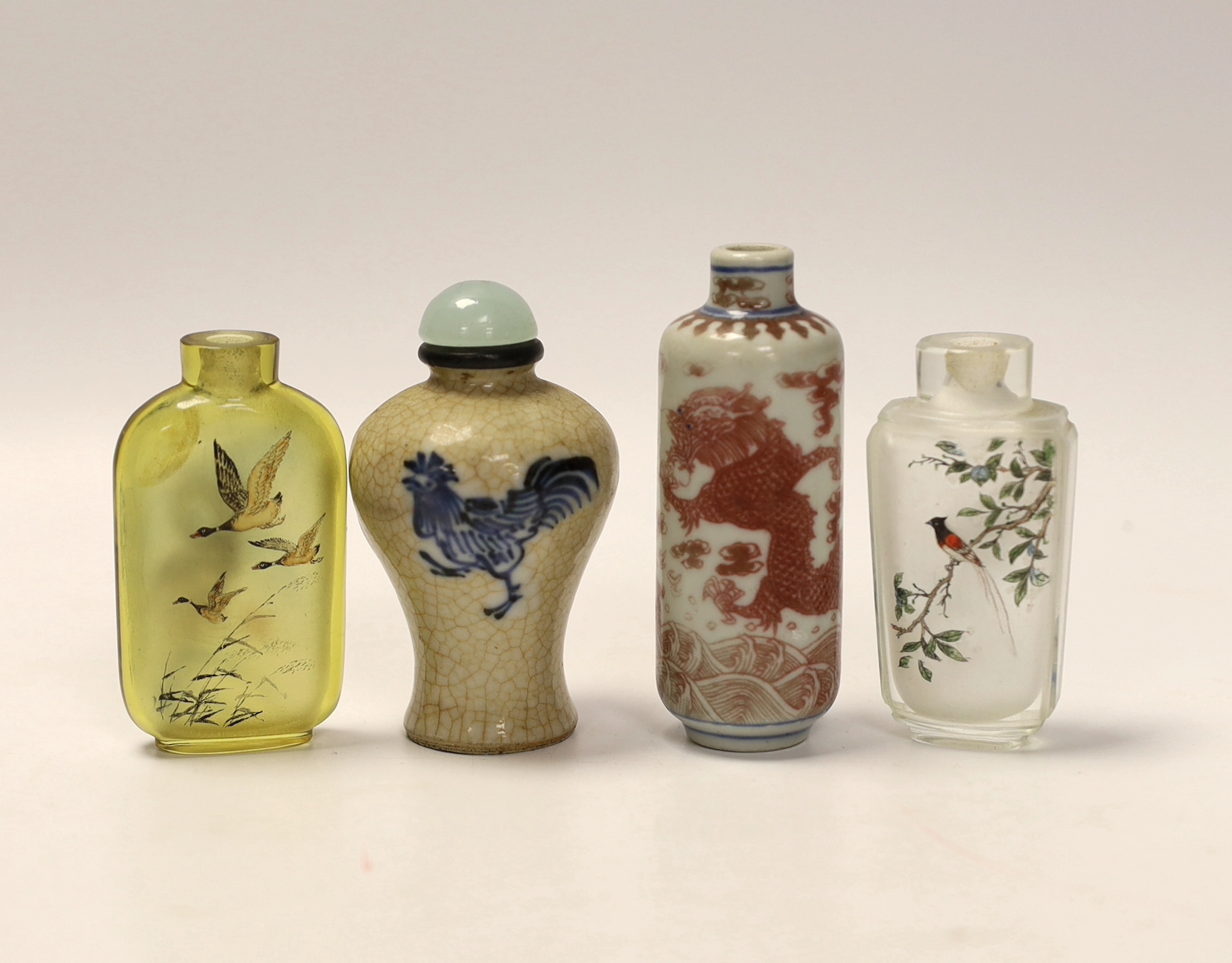 A Chinese crackle glaze snuff bottle, two inside painted glass snuff bottles and an underglaze copper red snuff bottle (4)
